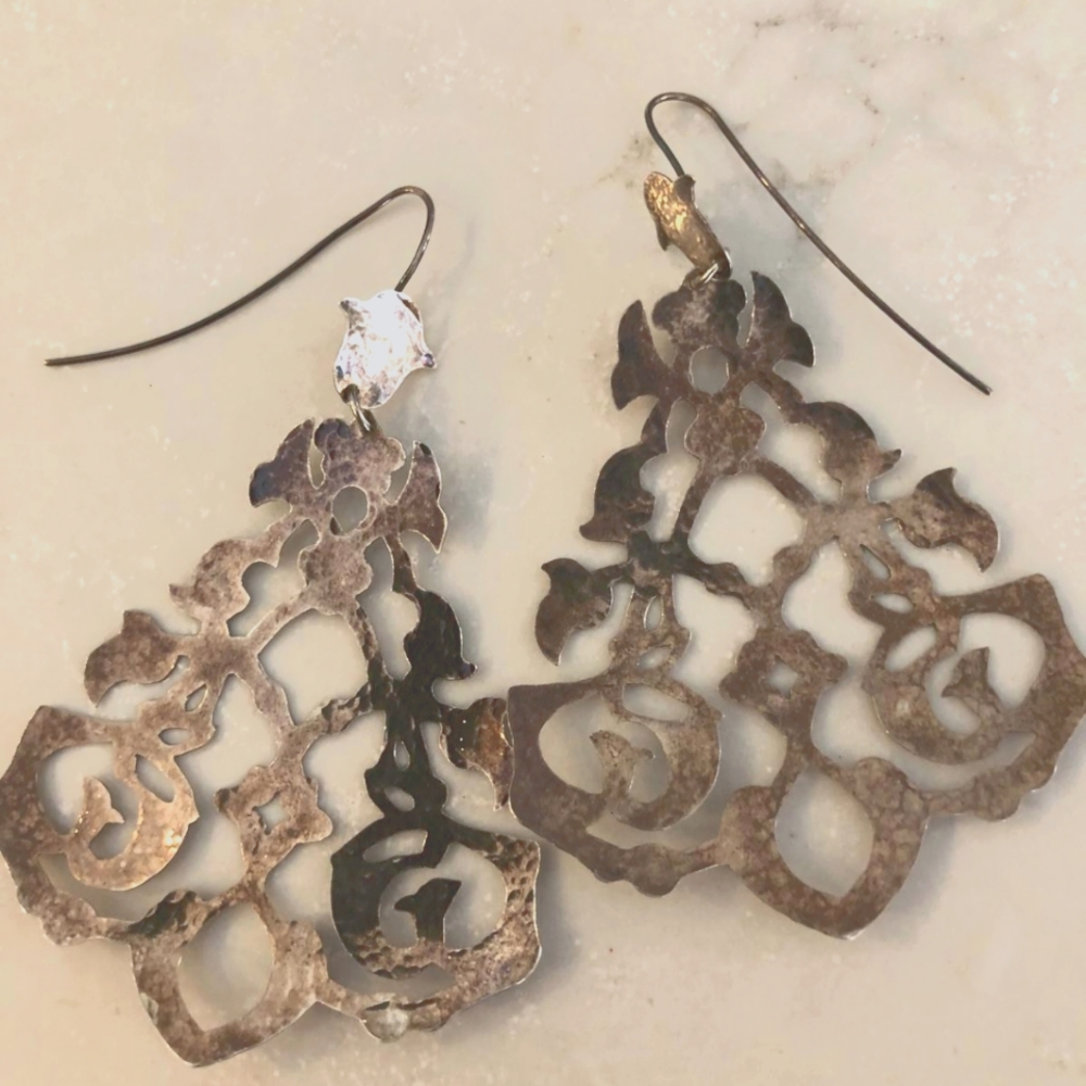 Silver hand carved dangling earrings